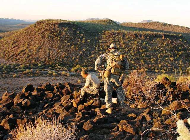 An effective security perimeter is not constrained by two dimensions.  This photo shows a surveillance LP/OP that was located on a hilltop 300 feet above and 1100 feet away from the corral shown in the previous photo.  Locations such as these can provide significant tactical advantage.  Communication between the LP/OP and camp were maintained via radio.